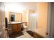 Bright bathroom featuring a shower, large vanity with sink and storage at 1128 S Duquesne Cir, Aurora, CO 80018