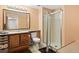 Bathroom with a single vanity, toilet, and a glass-enclosed shower at 1128 S Duquesne Cir, Aurora, CO 80018