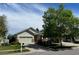 Inviting single-story home with a lush front yard and a two-car garage at 1128 S Duquesne Cir, Aurora, CO 80018
