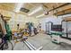 Spacious garage workshop with ample lighting and lots of power tools at 1128 S Duquesne Cir, Aurora, CO 80018