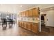 Spacious kitchen with ample cabinetry, countertop space and an adjacent dining area at 1128 S Duquesne Cir, Aurora, CO 80018