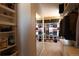 Spacious walk-in closet, with mirror and shelves at 1128 S Duquesne Cir, Aurora, CO 80018