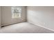 A bedroom showcasing neutral walls, trim and carpet and a window allowing for ample natural light at 6382 Freeport Dr, Highlands Ranch, CO 80130