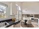 Bright dining area with a modern chandelier and an arch window that offers plenty of natural light at 6382 Freeport Dr, Highlands Ranch, CO 80130