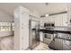 An open kitchen featuring stainless steel appliances and white cabinetry at 6382 Freeport Dr, Highlands Ranch, CO 80130
