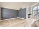 Open concept living room area with wood floors and easy access to the kitchen at 6382 Freeport Dr, Highlands Ranch, CO 80130