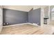 Open-concept living room featuring wood floors and neutral paint colors at 6382 Freeport Dr, Highlands Ranch, CO 80130