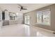 Open living room features neutral walls, wood-look floors, and natural light at 6382 Freeport Dr, Highlands Ranch, CO 80130