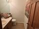 Small bathroom with updated vanity and flooring at 993 S Evanston Cir, Aurora, CO 80012