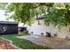 Large backyard with patio, shed and a brick building at 1315 Holly St, Denver, CO 80220