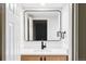 Modern bathroom with floating vanity and black matte faucet at 1315 Holly St, Denver, CO 80220