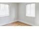 Bright bedroom with hardwood floors and window blinds at 1315 Holly St, Denver, CO 80220