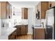 Updated kitchen with wood cabinets and white quartz countertops at 1315 Holly St, Denver, CO 80220