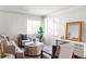 Bright living room featuring a neutral color palette and stylish furniture at 1315 Holly St, Denver, CO 80220