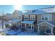 Three townhouses in a snow covered neighborhood at 13616 Garfield St # B, Thornton, CO 80602