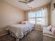 Charming bedroom with a window seat and built in shelving at 13616 Garfield St # B, Thornton, CO 80602