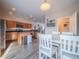 Bright dining area with a table and chairs, kitchen and living room views at 13616 Garfield St # B, Thornton, CO 80602