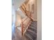 Elegant wooden staircase with dark wood flooring at 13616 Garfield St # B, Thornton, CO 80602