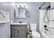 Bathroom featuring gray walls, modern vanity, toilet, and a shower with a shower curtain at 1287 S Wheeling Way, Aurora, CO 80012