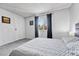 Bedroom featuring a large window for natural light, neutral walls, and plush gray carpeting at 1287 S Wheeling Way, Aurora, CO 80012
