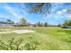 Open grassy field, basketball court, and residential neighborhood under a sunny sky at 1287 S Wheeling Way, Aurora, CO 80012