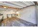 Spacious garage with ample room for parking and storage, featuring a concrete floor at 1287 S Wheeling Way, Aurora, CO 80012