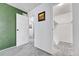 Hallway with neutral walls, and plush gray carpeting at 1287 S Wheeling Way, Aurora, CO 80012