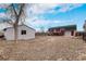 Spacious backyard featuring a shed, deck, and fenced perimeter at 206 Cedar St, Hudson, CO 80642