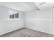 Finished basement space with carpet and a window at 206 Cedar St, Hudson, CO 80642