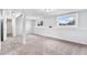 Carpeted basement with open layout and natural light from windows at 206 Cedar St, Hudson, CO 80642