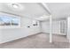 Spacious carpeted basement with natural light from egress windows at 206 Cedar St, Hudson, CO 80642