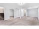 Spacious carpeted basement with open area and storage space at 206 Cedar St, Hudson, CO 80642