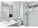Bathroom featuring a shower and vanity sink with a mirror at 206 Cedar St, Hudson, CO 80642
