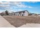 Home exterior showcasing the landscape, street, and charming facade at 206 Cedar St, Hudson, CO 80642
