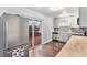 Updated kitchen leading to an outdoor deck with stainless steel appliances, butcher block countertop, and modern finishes at 206 Cedar St, Hudson, CO 80642