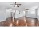 Spacious living room features hardwood floors, ceiling fans, and neutral walls offering a bright and airy atmosphere at 206 Cedar St, Hudson, CO 80642