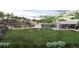 Expansive community green space with terraced landscaping, a playground, and a covered pavilion at 2021 Grayside Cir, Castle Rock, CO 80109