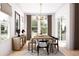 Inviting dining room with an elegant chandelier, stylish furniture, and great natural light at 2021 Grayside Cir, Castle Rock, CO 80109