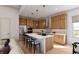 Bright, modern kitchen with stainless steel appliances, white countertops, and wood cabinets at 2021 Grayside Cir, Castle Rock, CO 80109
