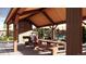 Inviting outdoor pavilion with stone fireplace, picnic tables, and gathering space at 2021 Grayside Cir, Castle Rock, CO 80109