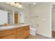Well-lit bathroom featuring double sinks, wood cabinets and tile floors at 8915 Federal Blvd # 104, Westminster, CO 80260