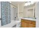 Bright bathroom featuring a shower-tub combination with a single sink vanity at 8915 Federal Blvd # 104, Westminster, CO 80260