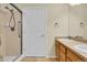 Primary bathroom with glass enclosed shower, double sinks and tile floors at 8915 Federal Blvd # 104, Westminster, CO 80260