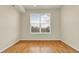 Spacious bedroom with hardwood floors and a large window at 8915 Federal Blvd # 104, Westminster, CO 80260