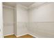 Spacious walk-in closet featuring white wire shelving and hardwood floors at 8915 Federal Blvd # 104, Westminster, CO 80260