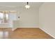 Bright dining area with hardwood floors and modern light fixture at 8915 Federal Blvd # 104, Westminster, CO 80260