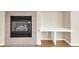 Close-up of fireplace with tile surround and built in desk area at 8915 Federal Blvd # 104, Westminster, CO 80260