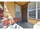 Close-up of the front porch with stylish brick accents and a cozy welcome mat at 8915 Federal Blvd # 104, Westminster, CO 80260
