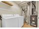 Well-lit laundry room with modern washer, dryer and furnace at 8915 Federal Blvd # 104, Westminster, CO 80260