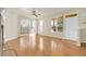 Bright living room with hardwood floors, ceiling fan, and sliding glass door at 8915 Federal Blvd # 104, Westminster, CO 80260